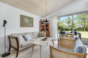 a living room with a couch and chairs and a table at 30140-Malling-Askvaenget-5 in Malling