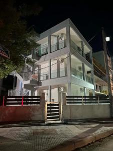 a large white building with stairs in front of it at Sunset Apartment B-3 in Perea
