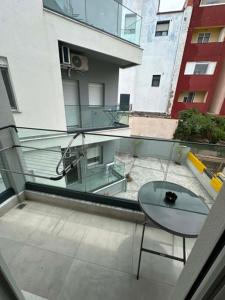 a balcony with a table and a view of a building at Sunset Apartment B-3 in Perea +2 photos