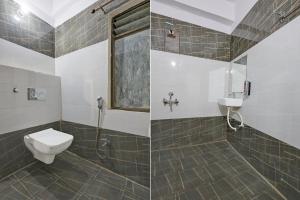 a bathroom with a toilet and a shower and a sink at Fabhotel Imperial 900 m from Sarnath Museum in Varanasi +24 photos