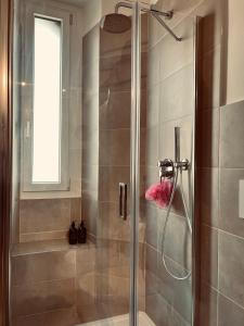 a shower with a glass door in a bathroom at 5 min from the center, Elevator , 4 guests, 2 bedrooms in Turin