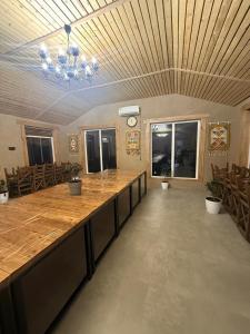 a large room with a large counter in a building at Kaganat village in Uchar
