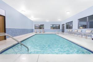 The swimming pool at or close to Days Inn & Suites by Wyndham Waterloo