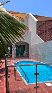 a swimming pool in front of a house at Rose Beach 7 درة العروس in Jeddah