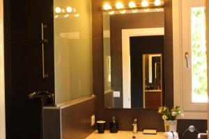 a bathroom with a sink with a large mirror at Casa Rural Balerdi in Azcárate +47 photos