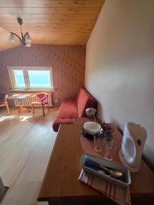 a living room with a table with glasses on it at Mewa House in Jastarnia
