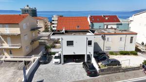 an aerial view of a house with a parking lot at Apartments Rose Loboja in Makarska