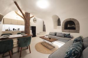 a living room with a couch and a table at Galaria Serenity Suites in Vóthon