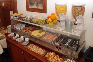 a buffet with many different types of food at Hotel Maria in Ostrava