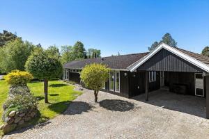 a house with trees in front of it at 1606-Liseleje-Lisevaenget-18 in Liseleje