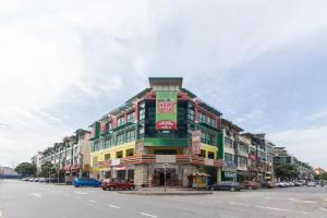 a large building with cars parked on a street at Hotel Sunjoy9 Bandar Sunway in Petaling Jaya
