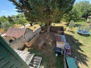 an aerial view of a yard with a playground at Le Clair Briare T2 charmant in Briare