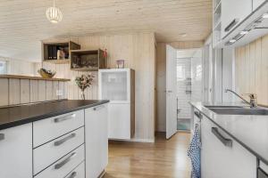 a kitchen with a sink and a refrigerator at 30189-Malling-Fjordvej-52 in Malling +34 photos