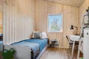 a small bedroom with a bed and a sink at 30189-Malling-Fjordvej-52 in Malling