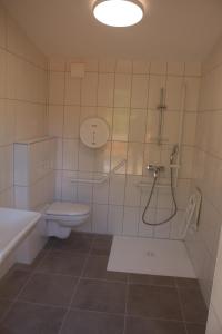 a bathroom with a toilet and a shower and a sink at Eco-Bivouac in La Tagnière