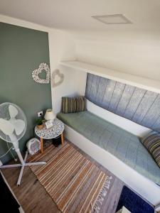 a bedroom with a bunk bed and a table at Glamping Langus in Topolšica