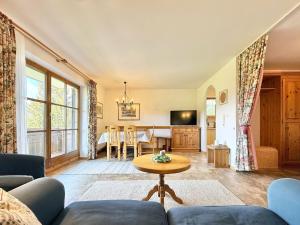 a living room with a couch and a table at Sonnenhof Seeg 01 in Seeg