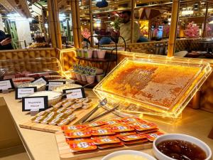 a display of honeybees on a counter in a store at Carat Hotel Yerevan in Yerevan +108 photos