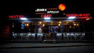 a row of chairs outside of a restaurant at night at Tiznit afolki in Tiznit