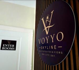 a sign for a yoyo sign on a wall at Voyyo Skyline in Durrës