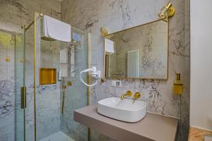 a bathroom with a sink and a shower at Zamek Dubiecko in Dubiecko +123 photos