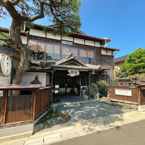 a building with a tree in front of it at Japanese style hotel and dining Morigen, Kyoto by the sea in Kyotango