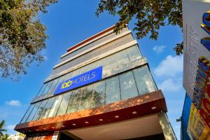a building with a blue sign on top of it at FabHotel Golden Stay I in Bangalore