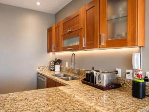 a kitchen counter with a toaster and a sink at Bucerias, Beachfront Penthouse in Bucerías