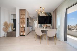 a dining room with a table and chairs at Luxury Residence Mauro in Makarska