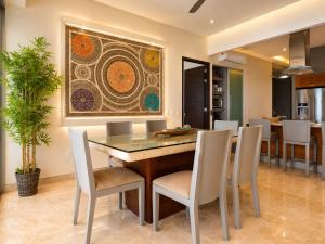 a dining room with a table and chairs at Bucerias, Beachfront Penthouse in Bucerías