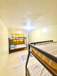 a room with two bunk beds in it at Maru Vibe Guesthouse V2 in San Juan