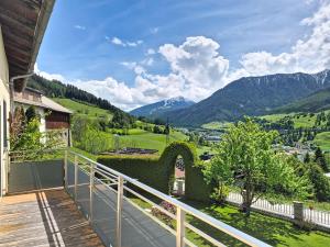 a balcony of a house with a view of the mountains at Apartment Halbeis by Interhome in Matrei am Brenner