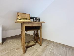 a wooden table with a radio on top of it at Apartment Halbeis by Interhome in Matrei am Brenner