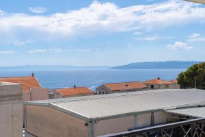 a view of the ocean from the roof of a building at Luxury Residence Mauro in Makarska