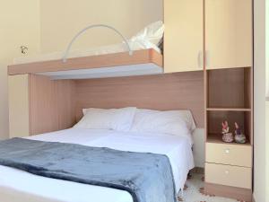 a bedroom with a bed and a bunk bed at Baia Verde - Dimitri House in Baia Verde +40 photos