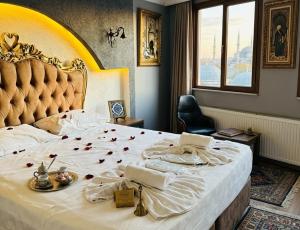 a bedroom with a large bed with roses on it at elisa hotel in Istanbul