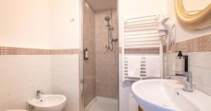 a bathroom with a sink and a toilet and a shower at Locanda Casalta in Strove +34 photos