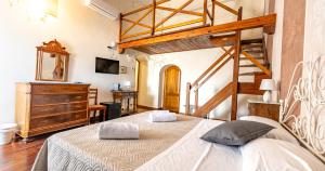 a bedroom with a large bed and a dresser at Locanda Casalta in Strove