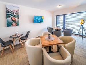 a waiting room with a table and chairs at Studio V Šachu by Interhome in Dačice