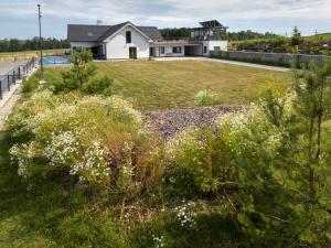 a house with a large yard with a grassy field at Studio V Šachu by Interhome in Dačice +29 photos