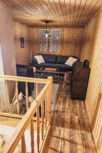 a living room with a couch and a table at Chalet Le Châtelaret by Interhome in Finhaut