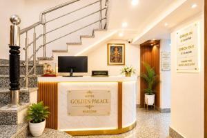 a lobby with a sign that says the golden market at Golden Palace in Kolkata