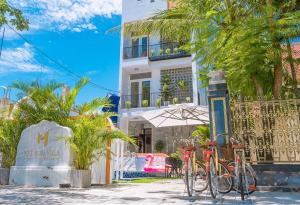 a group of bikes parked in front of a building at May Bliss Villa in Danang
