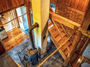 an overhead view of a spiral staircase in a wooden building at Chalet Chata Ujo by Interhome in Hranice