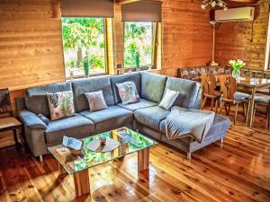 a living room with a couch and a table at Chalet Chata Ujo by Interhome in Hranice +42 photos