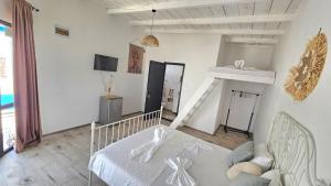a living room with a bed and a couch at Thea's Bungalow in Costinesti