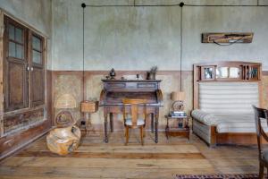 a living room with a table and a couch at Lurji Bani in Sighnaghi +72 photos