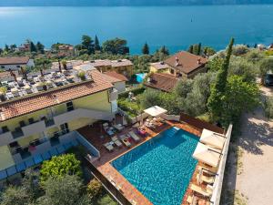 an aerial view of a villa with a swimming pool at Hotel Villa Smeralda in Malcesine