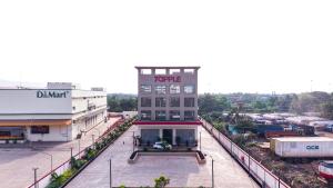 a building with a sign on the top of it at 7 Apple Hotel Visakhapatnam in Visakhapatnam
