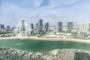 an aerial view of a city with a beach and buildings at Bloomfields Studio in Hydra Avenue - Reem in Abu Dhabi